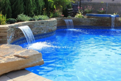 Free-Form-Pool-with-Spill-over-Spa-Sheer-Descent-Water-Features-and-Dive-Rock-Merrick-600x600