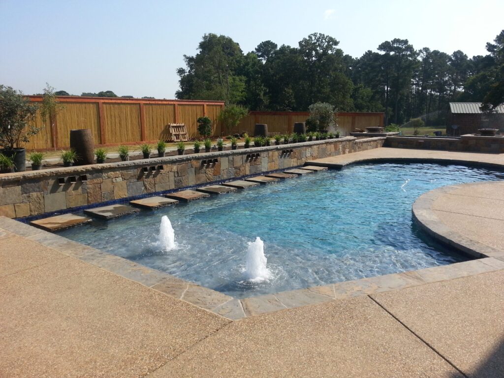 Tanning ledge and spa design in a custom gunite pool