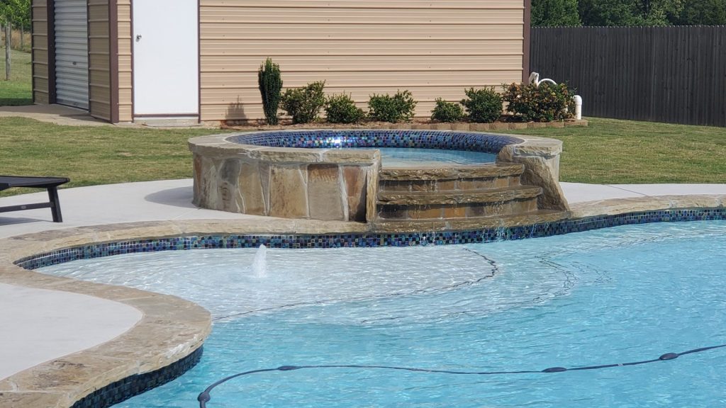 Custom pool with spa in Flower Mound, TX